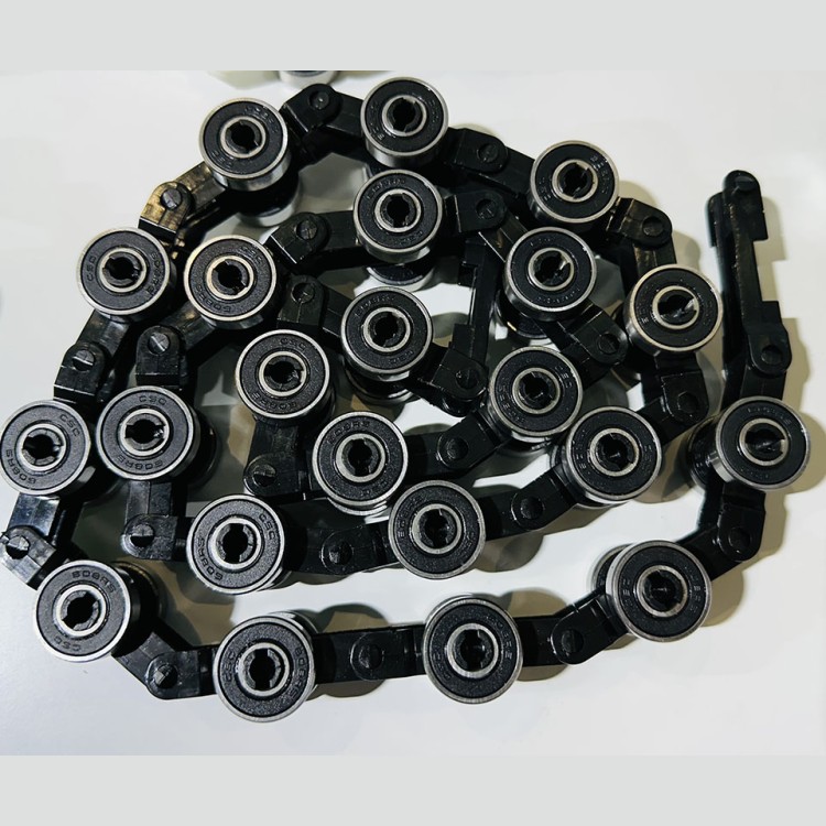 Обводная цепь торца балюстрады эскалатора 22 пары роликов TravelMaster (черная, старый тип) Kone