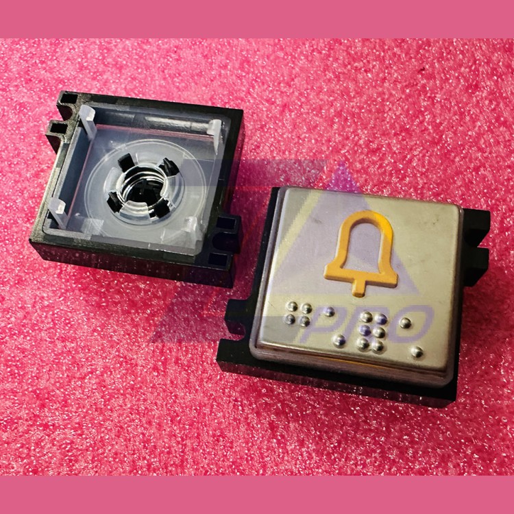 Толкатель кнопки с выдавленной надписью "колокольчик" шрифт Брайля Schindler